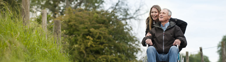 Image of a woman and man in a wheelchair